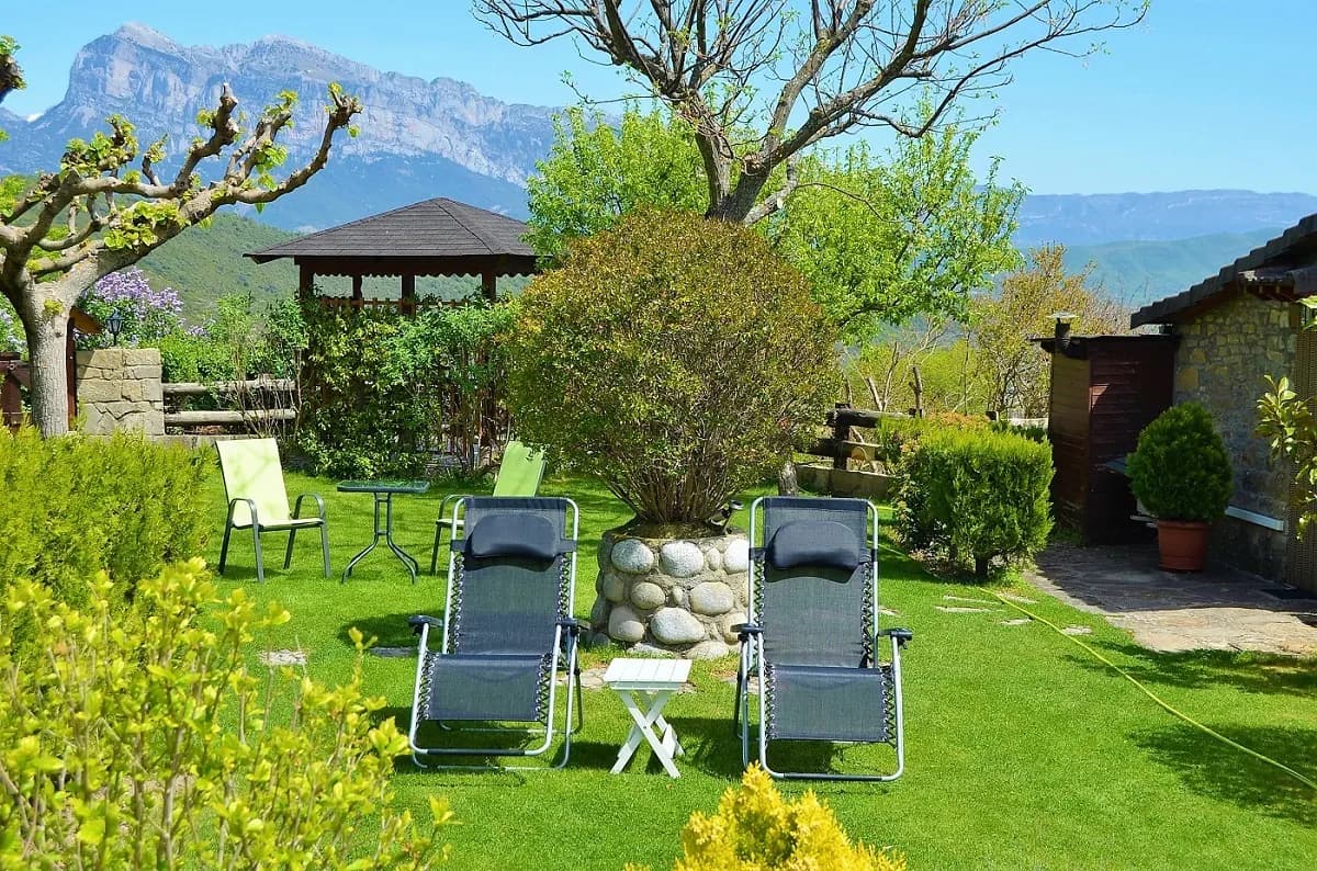 Garden loungers with mountain backdrop